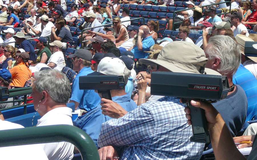 Scouts reading pitch velocity on radar guns (representative photo)